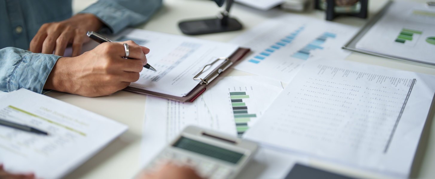 A person calculating CAM reconciliation charges